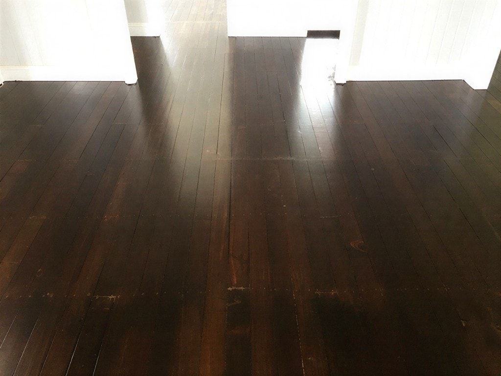 Dark chocolate-stained timber floor with a satin sheen